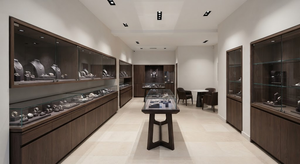 Low-glare LED spotlights illuminating jewellery displays in a contemporary European boutique.