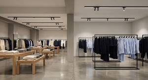 Fashion retail lighting comparison showing different linear LED power levels under balanced 4000K illumination.